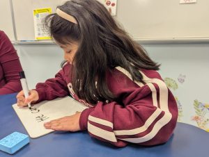 Student practices writing skills